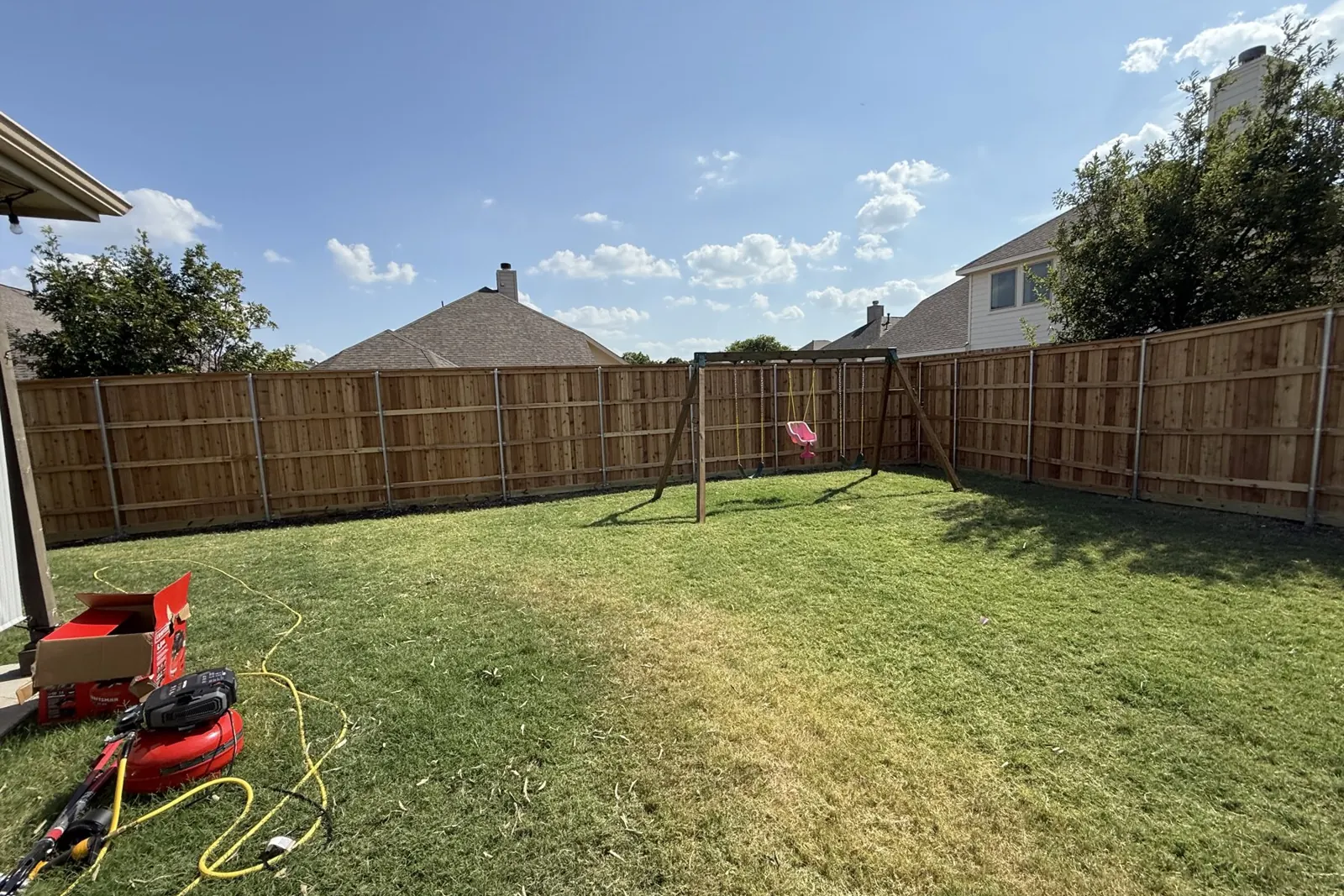 Cedar fence corner with steel posts in Frisco