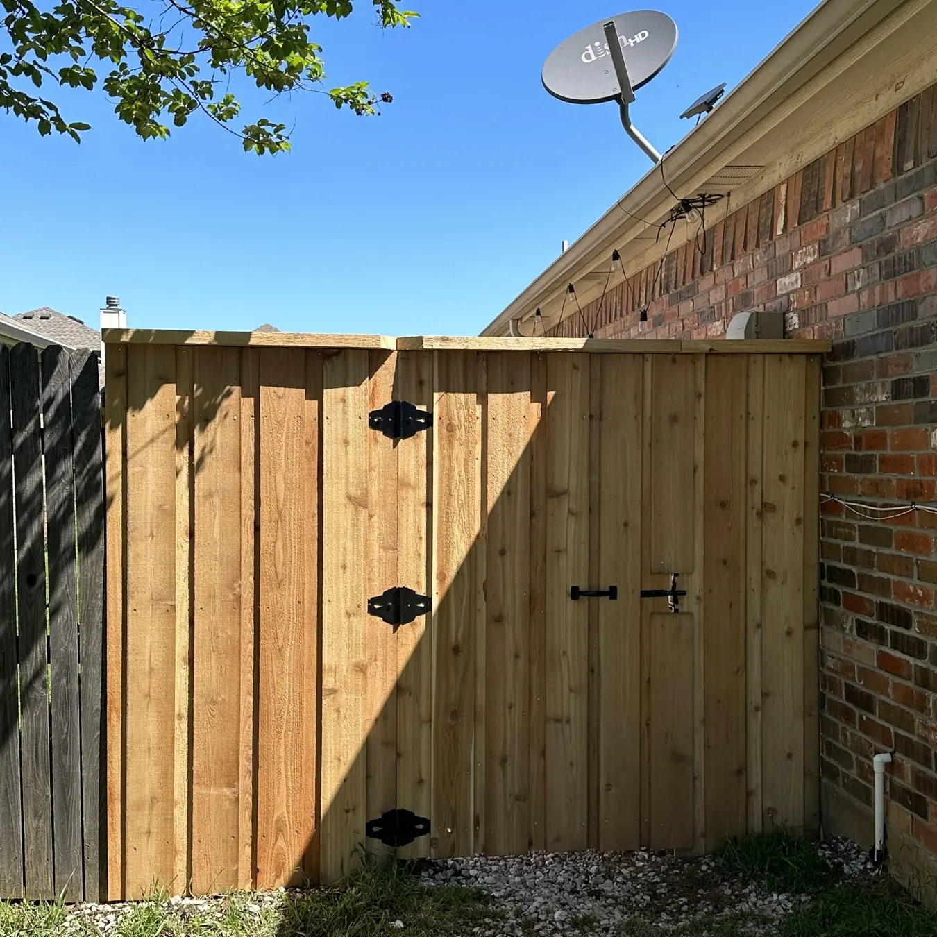 Custom cedar gate built by New Kingdom Contracting in Frisco, TX